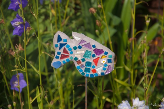 Glass mosaic fish in a Garden at the RHS Flower Show